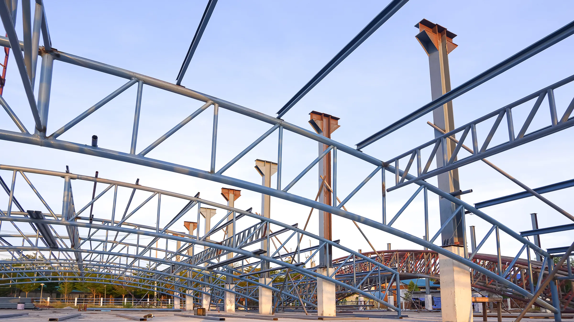 Steel purlins and open-web joists framed against the sky